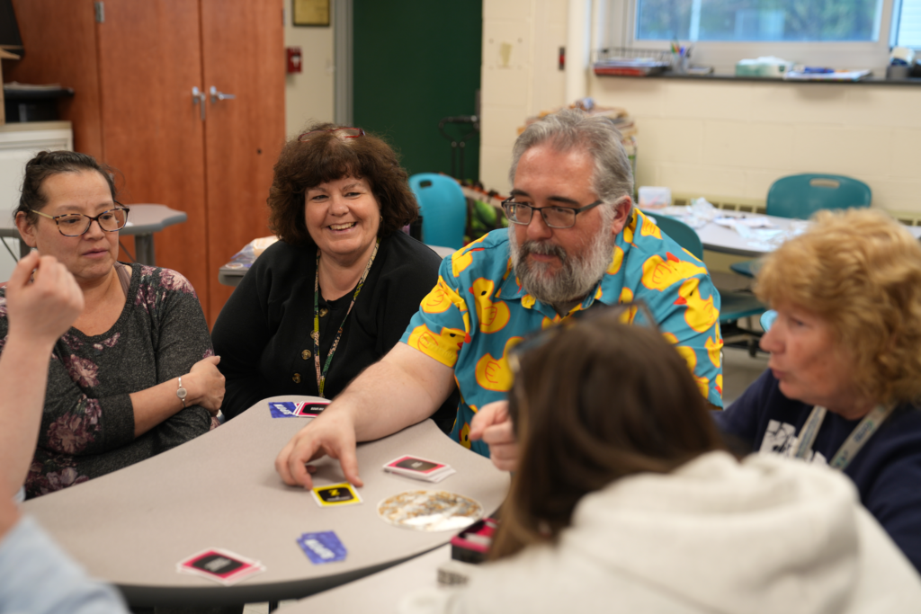 Colleagues enjoying time together at a table