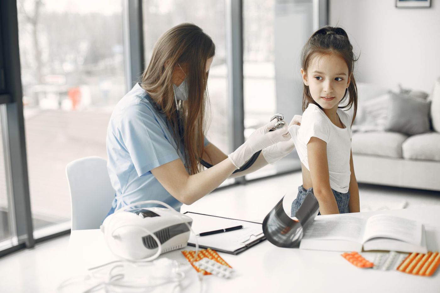 Health professional caring for a student