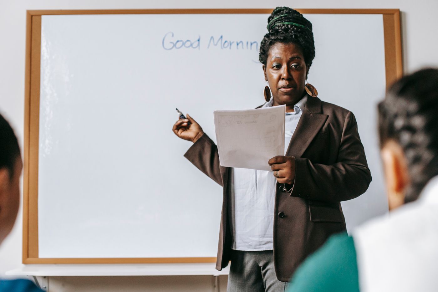 Teacher presenting a lesson at a whiteboard