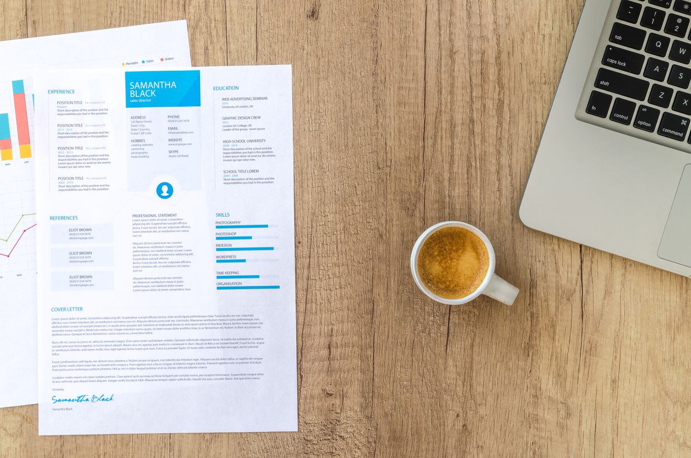 Printed résumé on a desk beside a coffee cup and laptop